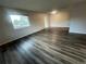 Sunlit living room with hardwood floors and neutral paint, creating a cozy atmosphere at 9762 Appletree Pl, Thornton, CO 80260