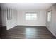 Bright living room with plenty of natural light and hardwood flooring at 9762 Appletree Pl, Thornton, CO 80260