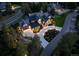 An aerial view of a large home surrounded by trees, showing a circular driveway and manicured landscaping at 1118 Northwood Ln, Castle Rock, CO 80108