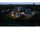 Night aerial view of a multi-story home showing architectural details and surrounding landscape at 1118 Northwood Ln, Castle Rock, CO 80108