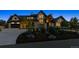 Stunning home exterior with stone accents, an attached garage, and manicured landscaping at 1118 Northwood Ln, Castle Rock, CO 80108