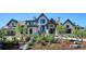 Attractive house with a landscaped yard featuring stone accents and diverse plants in a well-manicured garden at 1118 Northwood Ln, Castle Rock, CO 80108