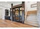 Interior view showing wine room, wet bar, and stairway at 1118 Northwood Ln, Castle Rock, CO 80108