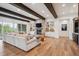 Spacious living room with stone fireplace, built-ins and hardwood floors at 1118 Northwood Ln, Castle Rock, CO 80108