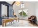 This office includes wooden accents, custom storage, and large windows overlooking a backyard view at 1118 Northwood Ln, Castle Rock, CO 80108