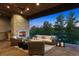 Covered patio with stone fireplace, comfortable seating, lanterns, and a beautiful view of the trees at 1118 Northwood Ln, Castle Rock, CO 80108