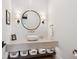 Stylish powder room with vessel sink, modern fixtures, and herringbone tile accent wall at 1118 Northwood Ln, Castle Rock, CO 80108