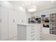 Well-organized walk-in closet featuring custom shelves, drawers, and ample storage space at 1118 Northwood Ln, Castle Rock, CO 80108