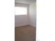 Bright, carpeted bedroom with a window providing ample natural light for a calm atmosphere at 10742 E Exposition Ave # 124, Aurora, CO 80012