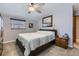 This light-filled bedroom offers carpeted floors, a ceiling fan, and neutral paint at 6953 W Roxbury Pl, Littleton, CO 80128