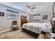 Bright bedroom with neutral walls, ceiling fan, and carpeted floors offers a relaxing retreat at 6953 W Roxbury Pl, Littleton, CO 80128