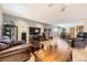 Inviting living room with hardwood floors, neutral paint colors, and lots of natural light at 6953 W Roxbury Pl, Littleton, CO 80128