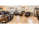 Spacious living room with hardwood floors, fireplace, and sliding door access to the patio at 6953 W Roxbury Pl, Littleton, CO 80128