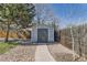 Backyard shed at the end of a walkway between the wood fence at 6953 W Roxbury Pl, Littleton, CO 80128