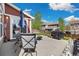 Backyard patio with outdoor dining set, BBQ and fire pit at 5786 Raleigh Cir, Castle Rock, CO 80104