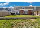 This backyard features a well-kept lawn and a spacious patio, ideal for entertainment at 5786 Raleigh Cir, Castle Rock, CO 80104