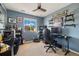 This is a bedroom featuring a window with an exterior view and a ceiling fan at 5786 Raleigh Cir, Castle Rock, CO 80104