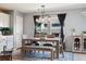 Comfortable dining area with bench seating, stylish lighting, and large window for natural light at 5786 Raleigh Cir, Castle Rock, CO 80104