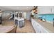 Open kitchen featuring stainless steel appliances, an island with seating, and a bright backsplash at 5786 Raleigh Cir, Castle Rock, CO 80104
