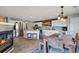 Spacious kitchen with stainless steel appliances, wood backsplash, and adjacent dining area at 5786 Raleigh Cir, Castle Rock, CO 80104