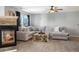 Cozy living room featuring a fireplace, comfortable seating, and natural light at 5786 Raleigh Cir, Castle Rock, CO 80104