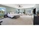 Spacious main bedroom featuring a large bed, sitting area, and ample natural light at 5786 Raleigh Cir, Castle Rock, CO 80104