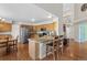 Open kitchen featuring wooden cabinets, stainless steel appliances, granite counters and breakfast bar at 9745 Quay Loop, Westminster, CO 80021