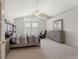 Main bedroom with vaulted ceiling, large windows, and neutral décor at 9745 Quay Loop, Westminster, CO 80021