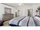 Bright main bedroom features vaulted ceiling, ceiling fan and access to ensuite bath and dressing room at 9745 Quay Loop, Westminster, CO 80021