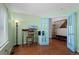 Home office with hardwood floors, natural light, and blue french doors at 9745 Quay Loop, Westminster, CO 80021