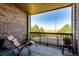 Private balcony with scenic views and a comfortable chair at 23376 E 5Th Pl # 101, Aurora, CO 80018