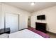 Bright bedroom with double doors to closet and a TV at 23376 E 5Th Pl # 101, Aurora, CO 80018