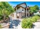 Two-story townhome with brick and siding exterior, walkway, and landscaping at 23376 E 5Th Pl # 101, Aurora, CO 80018