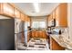 Well-equipped kitchen featuring granite countertops and stainless steel appliances at 23376 E 5Th Pl # 101, Aurora, CO 80018