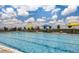 Community pool with umbrellas and lounge chairs at 23376 E 5Th Pl # 101, Aurora, CO 80018