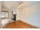 Dining room with a fireplace and access to the kitchen at 6374 Upham St, Arvada, CO 80003