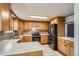 Bright kitchen with stainless steel appliances and ample counter space at 6374 Upham St, Arvada, CO 80003