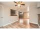 Open living area with wood-look floors, a functional pass-through and modern lighting, great for Gathering and entertaining at 6374 Upham St, Arvada, CO 80003