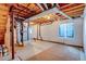 Unfinished basement with HVAC and a window for natural light at 23320 E Berry Ave, Aurora, CO 80016