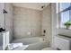 Clean bathroom with tub, shower and updated fixtures at 23320 E Berry Ave, Aurora, CO 80016