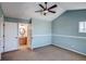 Primary bedroom with vaulted ceiling, ceiling fan and ensuite bathroom at 23320 E Berry Ave, Aurora, CO 80016