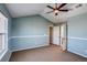 Bright bedroom with vaulted ceiling, ceiling fan and access to bathroom at 23320 E Berry Ave, Aurora, CO 80016