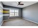 Bedroom with gray and yellow striped wall, ceiling fan and carpet at 23320 E Berry Ave, Aurora, CO 80016