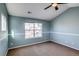 Spacious bedroom with light blue walls and ceiling fan at 23320 E Berry Ave, Aurora, CO 80016