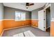 Bedroom with gray and orange walls, carpet, and a window at 23320 E Berry Ave, Aurora, CO 80016