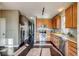 Bright kitchen featuring stainless steel appliances and hardwood floors at 23320 E Berry Ave, Aurora, CO 80016