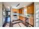 Modern kitchen featuring stainless steel appliances and light wood cabinets at 23320 E Berry Ave, Aurora, CO 80016