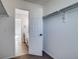 Large walk-in closet with built-in shelving and access to bathroom at 23320 E Berry Ave, Aurora, CO 80016