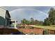 Large fenced backyard featuring a rainbow view, trees, and landscaping creating a private outdoor space at 640 Avena Dr, Elizabeth, CO 80107