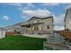 Spacious backyard featuring lush green grass and convenient patio at 640 Avena Dr, Elizabeth, CO 80107